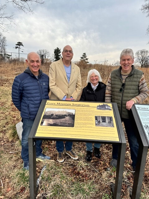 Members of the Rotary Club of the Caldwells (L)and Hilltop Board Members (R) admiring the new Panel.